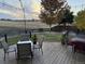 Spacious deck with seating area and sunset view at 5016 Cresthill Pl, Highlands Ranch, CO 80130