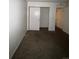 Simple bedroom with neutral carpeting and a closet at 10772 E Exposition Ave # 141, Aurora, CO 80012