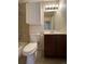 Clean bathroom with a tiled shower/tub combo, vanity, and toilet at 4691 S Kittredge Way, Aurora, CO 80015