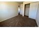 Spacious bedroom with carpeted floor and mirrored closet doors at 4691 S Kittredge Way, Aurora, CO 80015