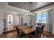 Formal dining room with hardwood floors, large window, and decorative ceiling at 41860 Muirfield Loop, Elizabeth, CO 80107