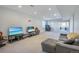 Finished basement Gathering room with two sofas and entertainment area at 41860 Muirfield Loop, Elizabeth, CO 80107