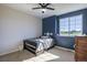 Well-lit bedroom with a twin-size bed and a view at 41860 Muirfield Loop, Elizabeth, CO 80107