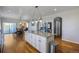 Open concept kitchen with white cabinets, granite countertops, and an island at 41860 Muirfield Loop, Elizabeth, CO 80107