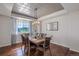 Formal dining room with hardwood floors, large window, and decorative ceiling at 41860 Muirfield Loop, Elizabeth, CO 80107