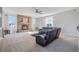 Bright and airy living room with a stone fireplace and plenty of natural light at 41860 Muirfield Loop, Elizabeth, CO 80107