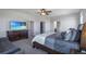Main bedroom with large windows, a king-size bed, and plenty of closet space at 41860 Muirfield Loop, Elizabeth, CO 80107
