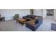 Finished basement recreation area with sectional sofa and coffee table at 41860 Muirfield Loop, Elizabeth, CO 80107