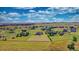 Wide aerial view of neighborhood and surrounding landscape at 41860 Muirfield Loop, Elizabeth, CO 80107