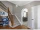Elegant staircase with a wooden railing leading to the upper level at 41860 Muirfield Loop, Elizabeth, CO 80107