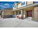 Two-story home with stone accents and a welcoming front porch at 41860 Muirfield Loop, Elizabeth, CO 80107