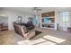 Spacious living room with large windows and a cozy fireplace at 41860 Muirfield Loop, Elizabeth, CO 80107