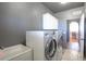 Convenient laundry room with washer, dryer, and cabinets at 41860 Muirfield Loop, Elizabeth, CO 80107