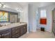 Double vanity bathroom with granite countertops, soaking tub, and separate shower at 41860 Muirfield Loop, Elizabeth, CO 80107