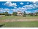Two-story house with attached garage and landscaping at 41860 Muirfield Loop, Elizabeth, CO 80107