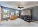 Blue bedroom with carpeted floors and ceiling fan at 1020 Lilac St, Broomfield, CO 80020