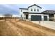 Modern farmhouse style home with a three-car garage and inviting curb appeal at 4487 Boone Cir, Brighton, CO 80601