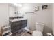 Modern bathroom with floating vanity and a toilet at 1181 Yosemite St, Denver, CO 80220