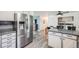 Open kitchen with stainless steel refrigerator and island at 1181 Yosemite St, Denver, CO 80220