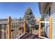 Deck steps with view of yard and trees at 3601 Sunrise Ln, Brighton, CO 80603
