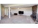 Finished basement with a fireplace, TV, and plenty of space at 3601 Sunrise Ln, Brighton, CO 80603