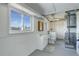 Basement bathroom with toilet, sink, and washer at 3601 Sunrise Ln, Brighton, CO 80603