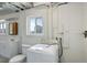 Basement bathroom with toilet and washer at 3601 Sunrise Ln, Brighton, CO 80603