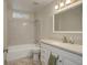 Clean bathroom with a shower/tub combo, white vanity, and a mirror at 3601 Sunrise Ln, Brighton, CO 80603