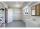 Basement bathroom with vanity, sink and shelving at 3601 Sunrise Ln, Brighton, CO 80603