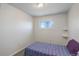 Small bedroom with a double bed and floating shelves at 3601 Sunrise Ln, Brighton, CO 80603