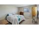 Cozy bedroom with a double bed, dresser and a window with blinds at 3601 Sunrise Ln, Brighton, CO 80603