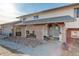 Brick entryway with arched covered porch and a gray door at 3601 Sunrise Ln, Brighton, CO 80603