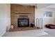 Brick fireplace with a wood-burning stove in the basement at 3601 Sunrise Ln, Brighton, CO 80603