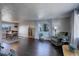 Open concept living and dining area with hardwood floors at 3601 Sunrise Ln, Brighton, CO 80603