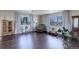 Relaxing living room with hardwood floors, large windows and comfortable seating at 3601 Sunrise Ln, Brighton, CO 80603