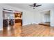 Bright living room with hardwood floors and views of the kitchen at 3624 S Ivory Ct, Aurora, CO 80013