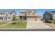 Two-story home with attached garage and well-manicured lawn at 42395 Forest Oaks Dr, Elizabeth, CO 80107