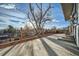 Large backyard patio with tree shade and city views at 486 Leona Dr, Denver, CO 80221