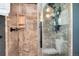 Large walk-in shower with glass enclosure and modern tile at 7311 W Weaver Pl, Littleton, CO 80123