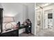 Bedroom with desk and mirrored closet doors at 12503 E Pacific Cir # E, Aurora, CO 80014