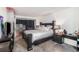 Bedroom with a large bed and dark wood furniture at 12503 E Pacific Cir # E, Aurora, CO 80014