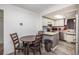 Bright kitchen featuring a breakfast nook and modern appliances at 12503 E Pacific Cir # E, Aurora, CO 80014