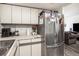 Bright kitchen features stainless steel appliances and ample counter space at 12503 E Pacific Cir # E, Aurora, CO 80014