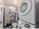Laundry room with washer, dryer, and utility space at 12503 E Pacific Cir # E, Aurora, CO 80014