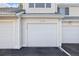 Attached garage with white door at 12503 E Pacific Cir # E, Aurora, CO 80014