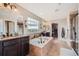 Spacious bathroom with soaking tub, double vanity, and walk-in shower at 872 Eveningsong Dr, Castle Rock, CO 80104