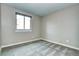 Simple bedroom with gray carpet and window at 251 S Carter Ave, Louisville, CO 80027