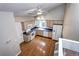 Galley kitchen with wood cabinets and hardwood floor at 251 S Carter Ave, Louisville, CO 80027