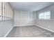 Spacious basement room with gray carpeting and built-in shelving at 251 S Carter Ave, Louisville, CO 80027