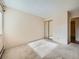 Well lit bedroom with mirrored closet doors at 13961 E Marina Dr # 205, Aurora, CO 80014